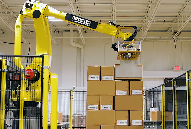 Robotic Food Case Palletizer stacking boxes on a pallet