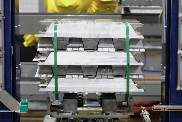 Metal Ingot Robotic Cell Workload Being Placed By a Robotic Palletizer